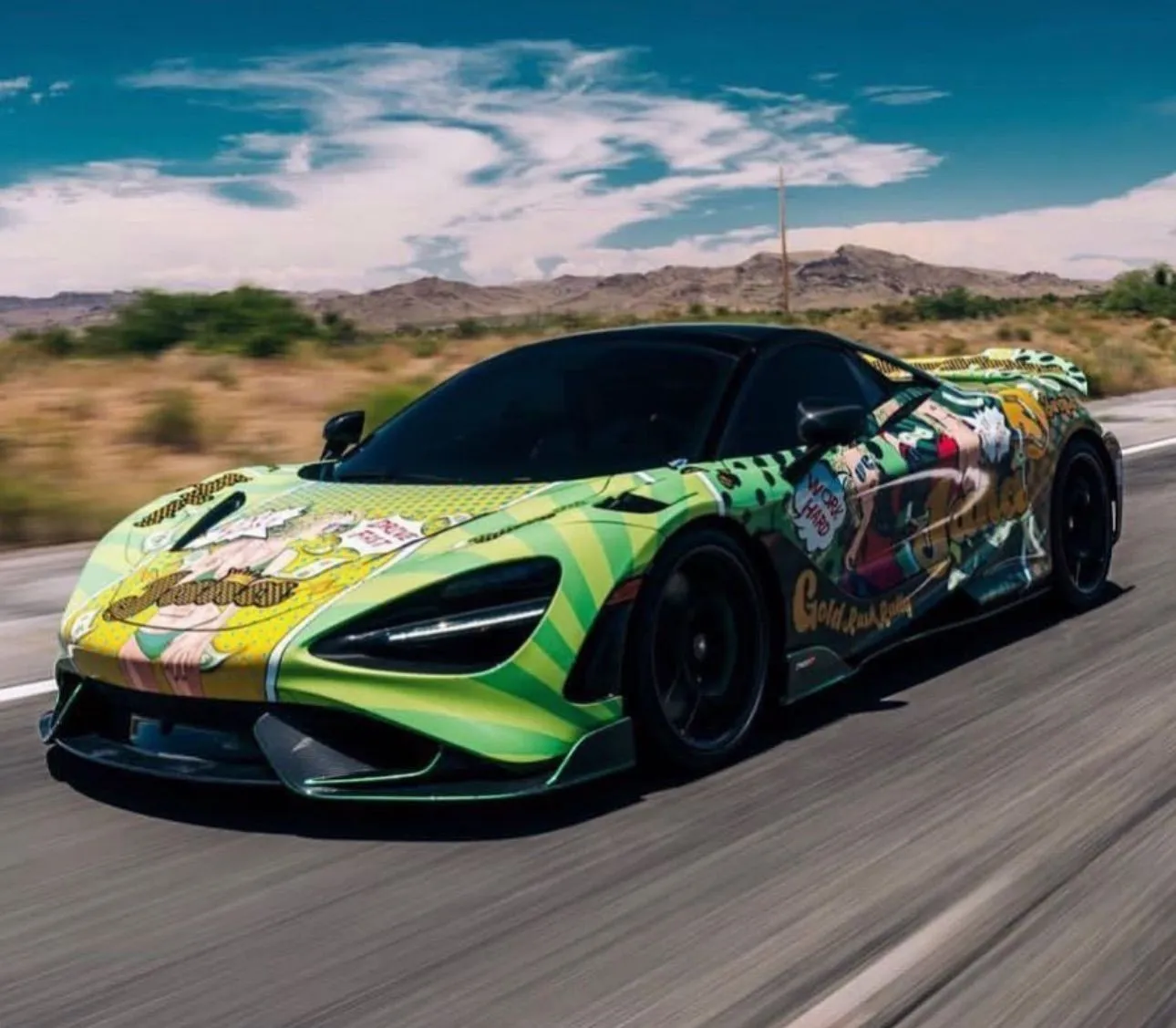 Custom graphic wrap on a sports car driving through the desert